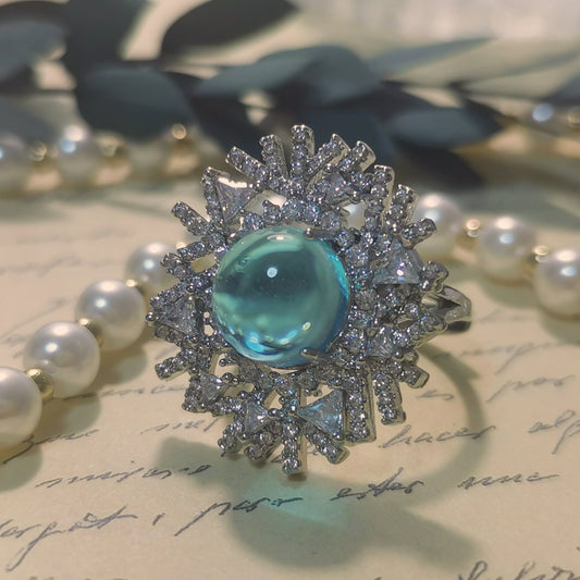 Designer Ring Snowflake Shaped Silver Ring with Spherical Cut Sky Blue CZ